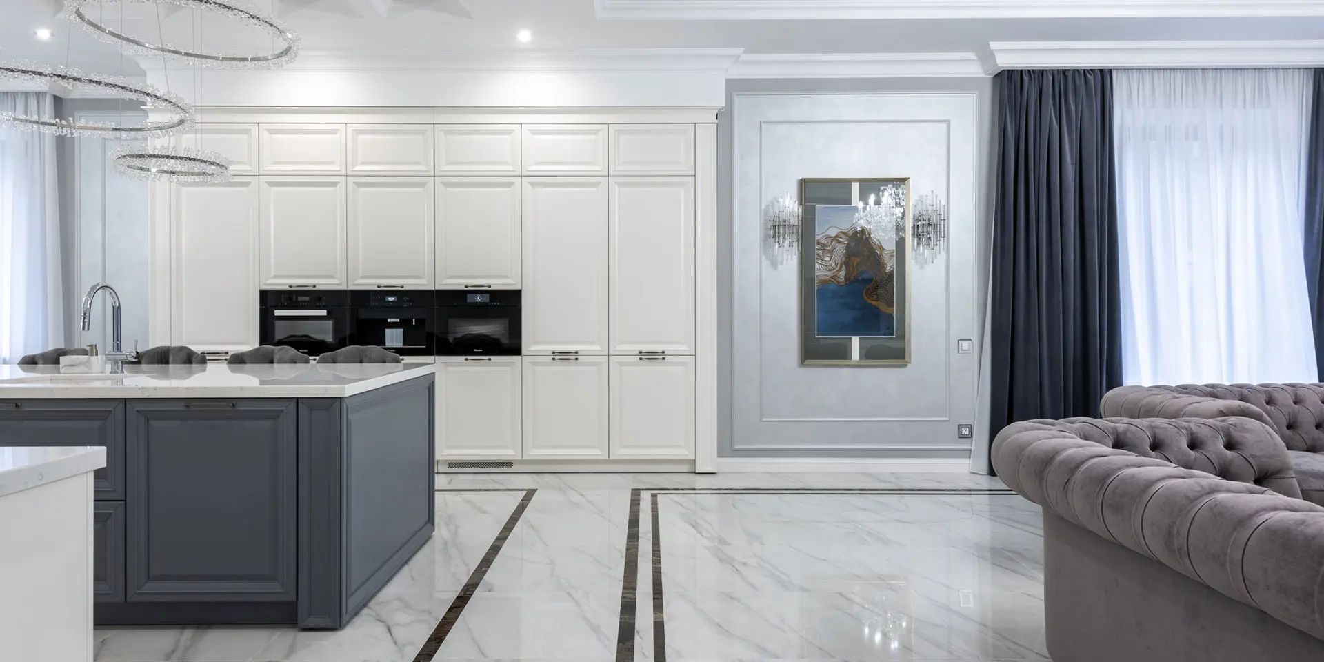 The kitchen is mostly white with wood cabinets and appliances and a stainless sink